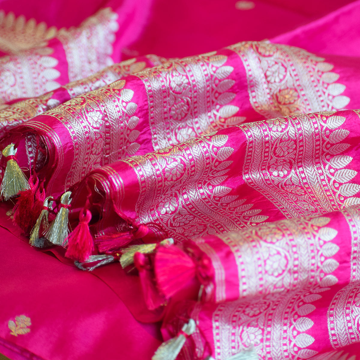 Rani Pink Handwoven Banarasi Munga Muslin Suit Set with Intricate Zari Borders & Playful Tassels