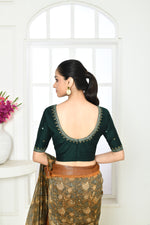 Bottle green pure raw silk elbow length blouse with golden floral embroidery in sleeves, front and back neck.