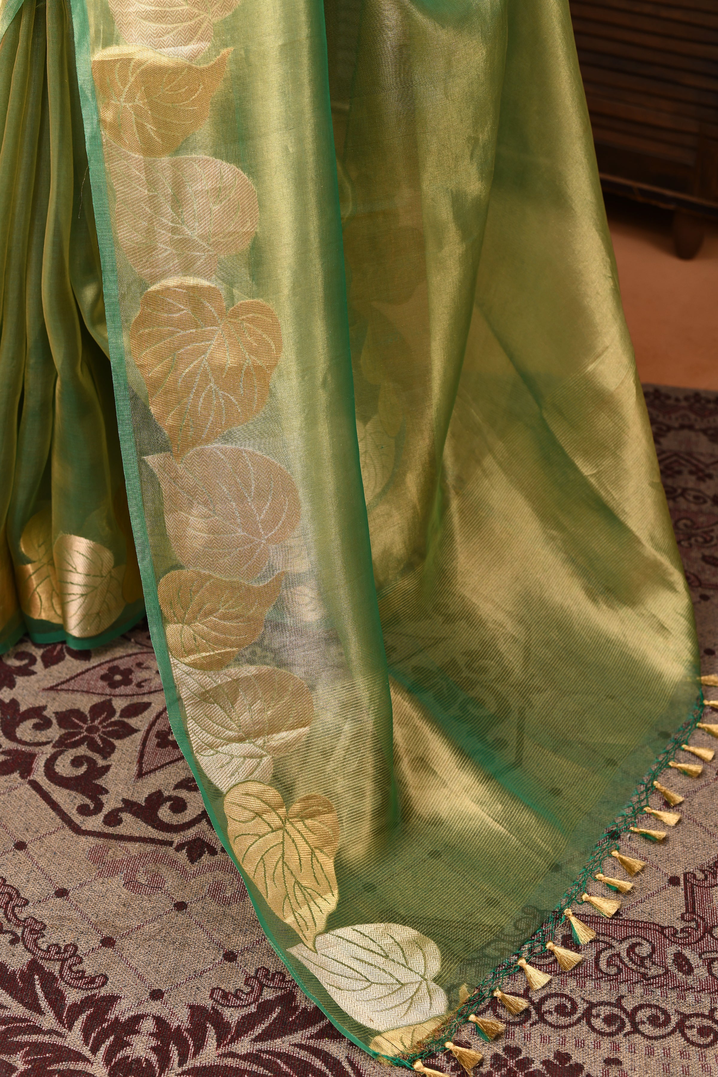 Banarasi tissue silk saree with leaf pattern woven border-Emerald green
