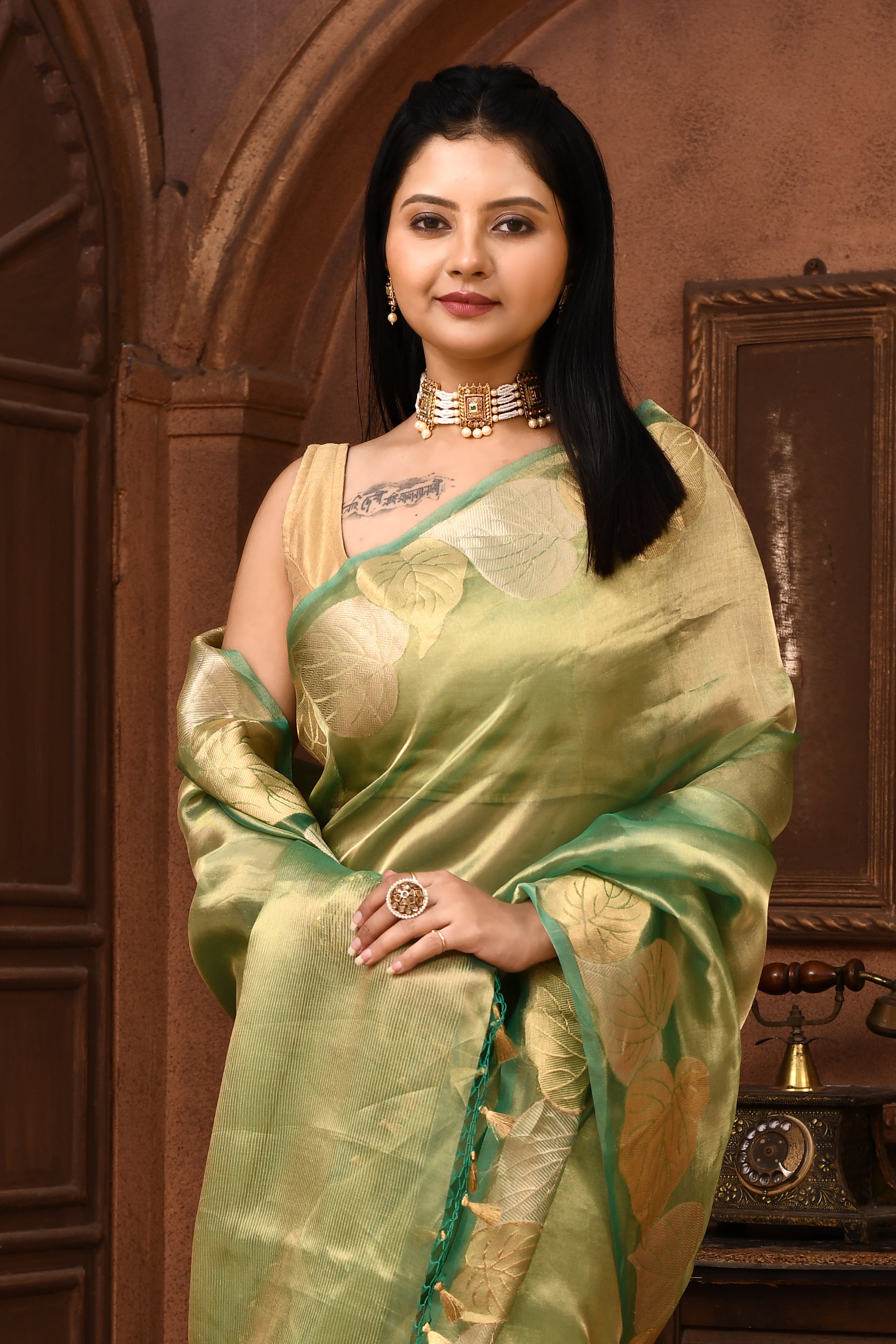 Banarasi tissue silk saree with leaf pattern woven border-Emerald green