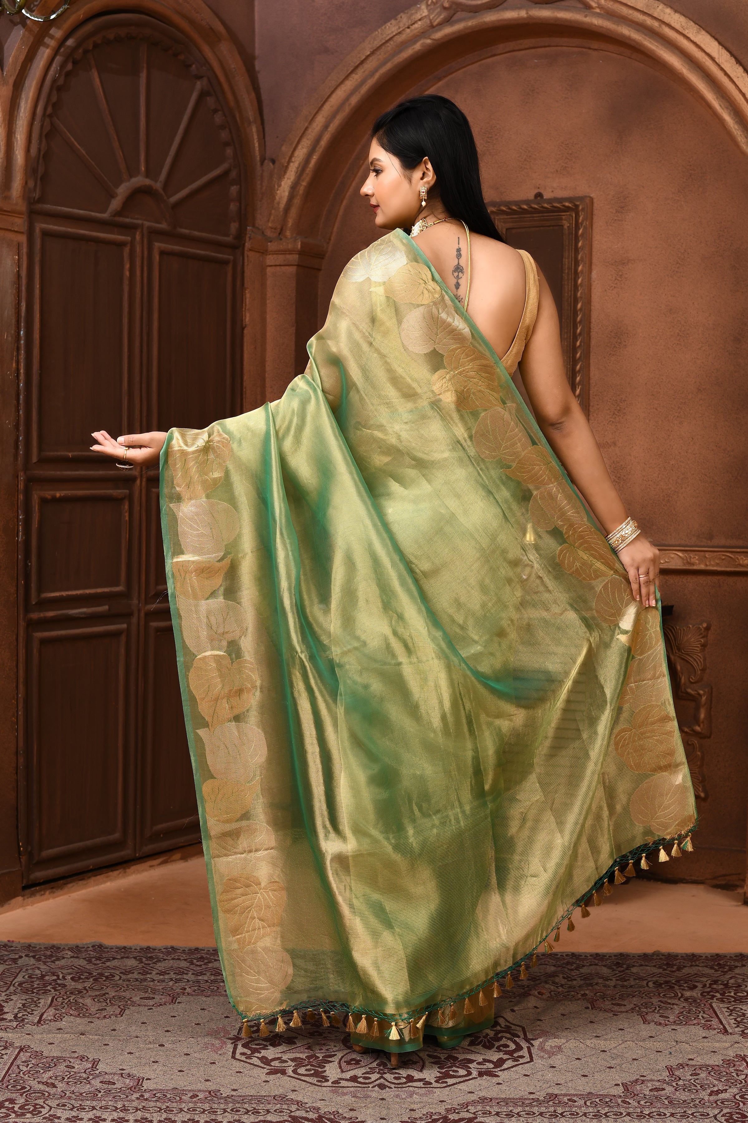 Banarasi tissue silk saree with leaf pattern woven border-Emerald green