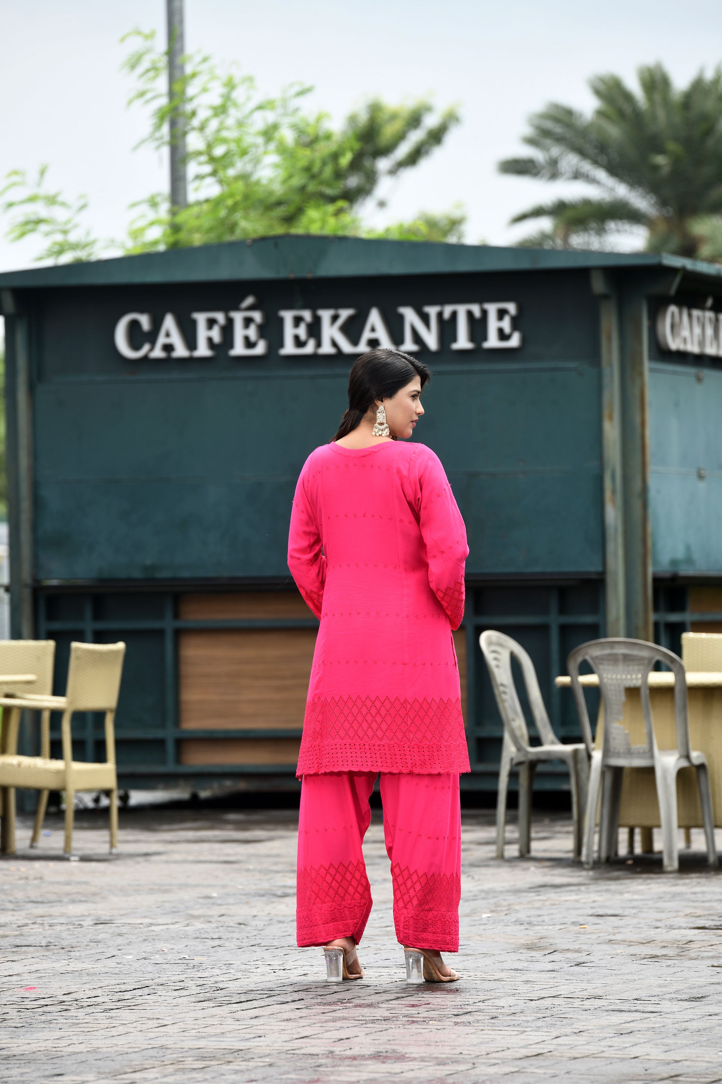 Vibrant fuschia pink flared sleeves mid thigh length straight kurta and farshi salwar set with cut work embroidery