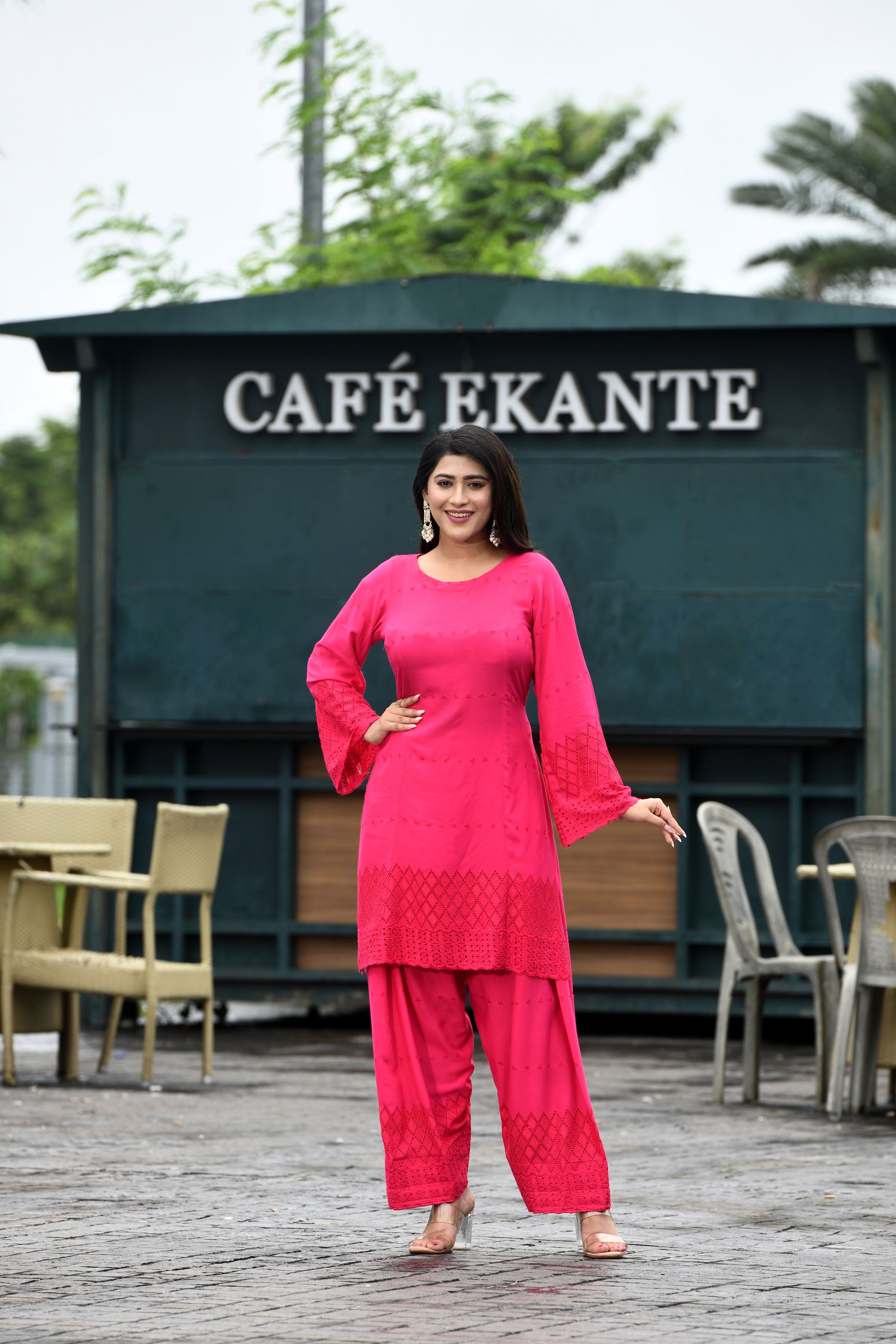 Vibrant fuschia pink flared sleeves mid thigh length straight kurta and farshi salwar set with cut work embroidery