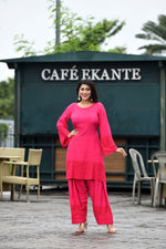 Vibrant fuschia pink flared sleeves mid thigh length straight kurta and farshi salwar set with cut work embroidery
