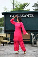 Vibrant fuschia pink flared sleeves mid thigh length straight kurta and farshi salwar set with cut work embroidery