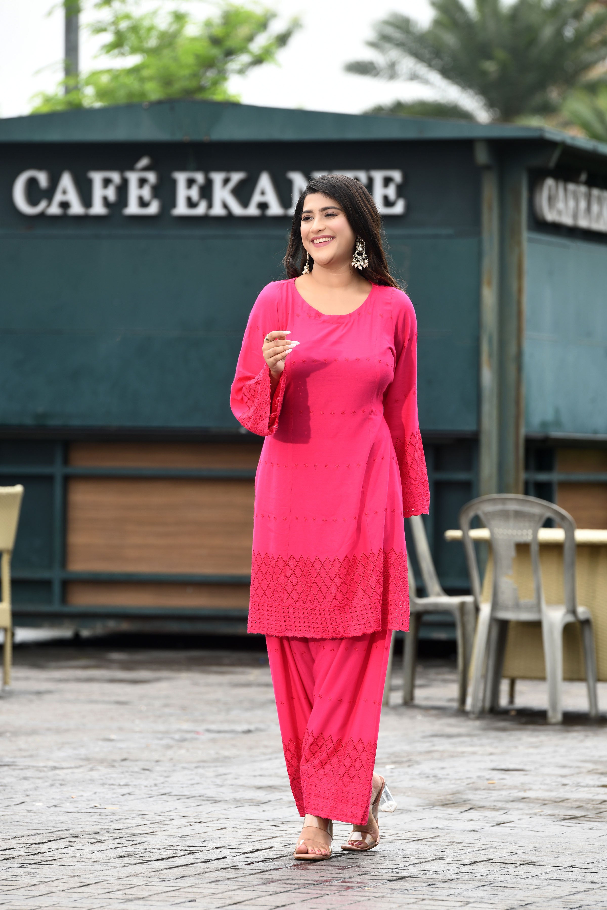 Vibrant fuschia pink flared sleeves mid thigh length straight kurta and farshi salwar set with cut work embroidery