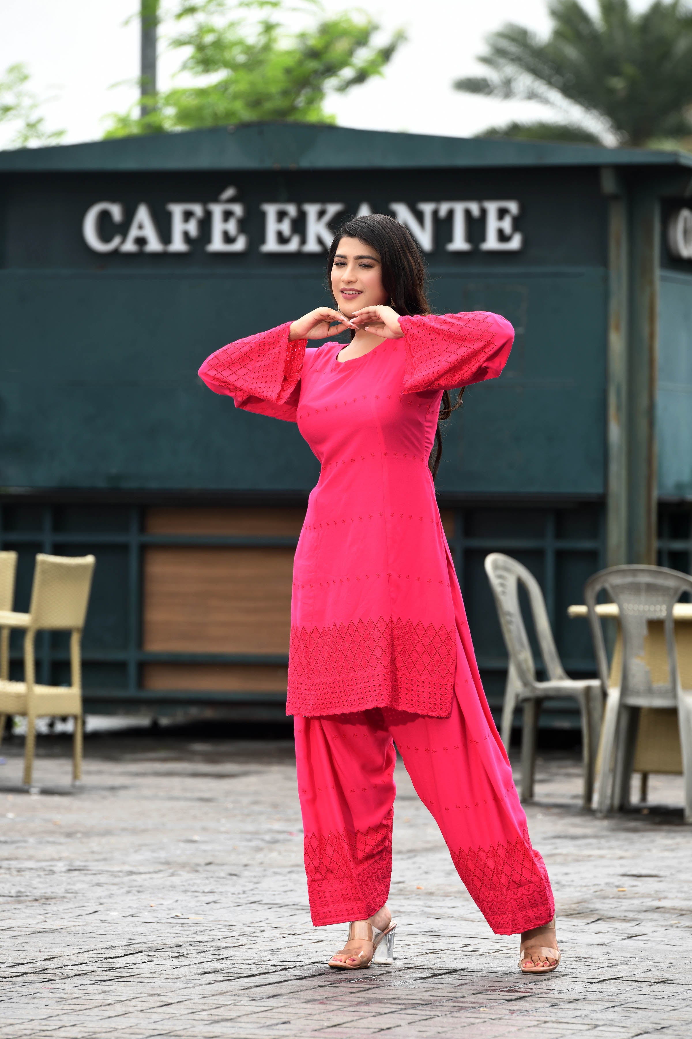 Vibrant fuschia pink flared sleeves mid thigh length straight kurta and farshi salwar set with cut work embroidery