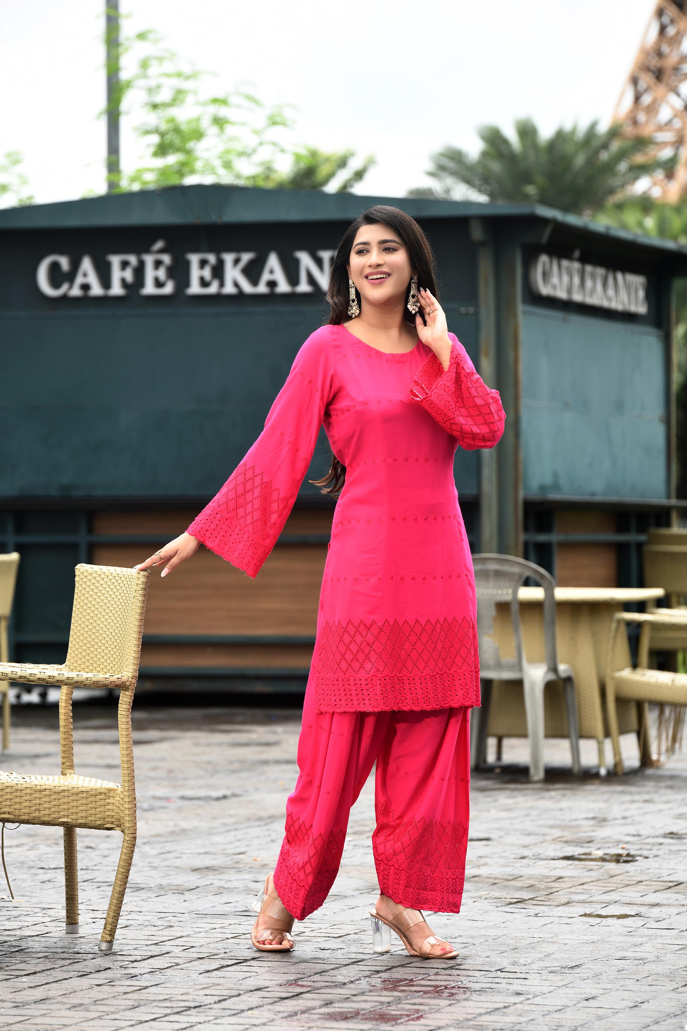 Vibrant fuschia pink flared sleeves mid thigh length straight kurta and farshi salwar set with cut work embroidery