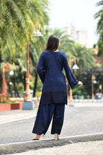 Rich Indigo blue flared sleeves mid thigh length straight kurta and farshi salwar set with cut work embroidery