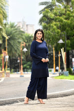 Rich Indigo blue flared sleeves mid thigh length straight kurta and farshi salwar set with cut work embroidery