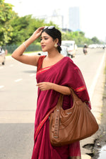 Magenta cotton silk hand woven saree with dark pink and golden border