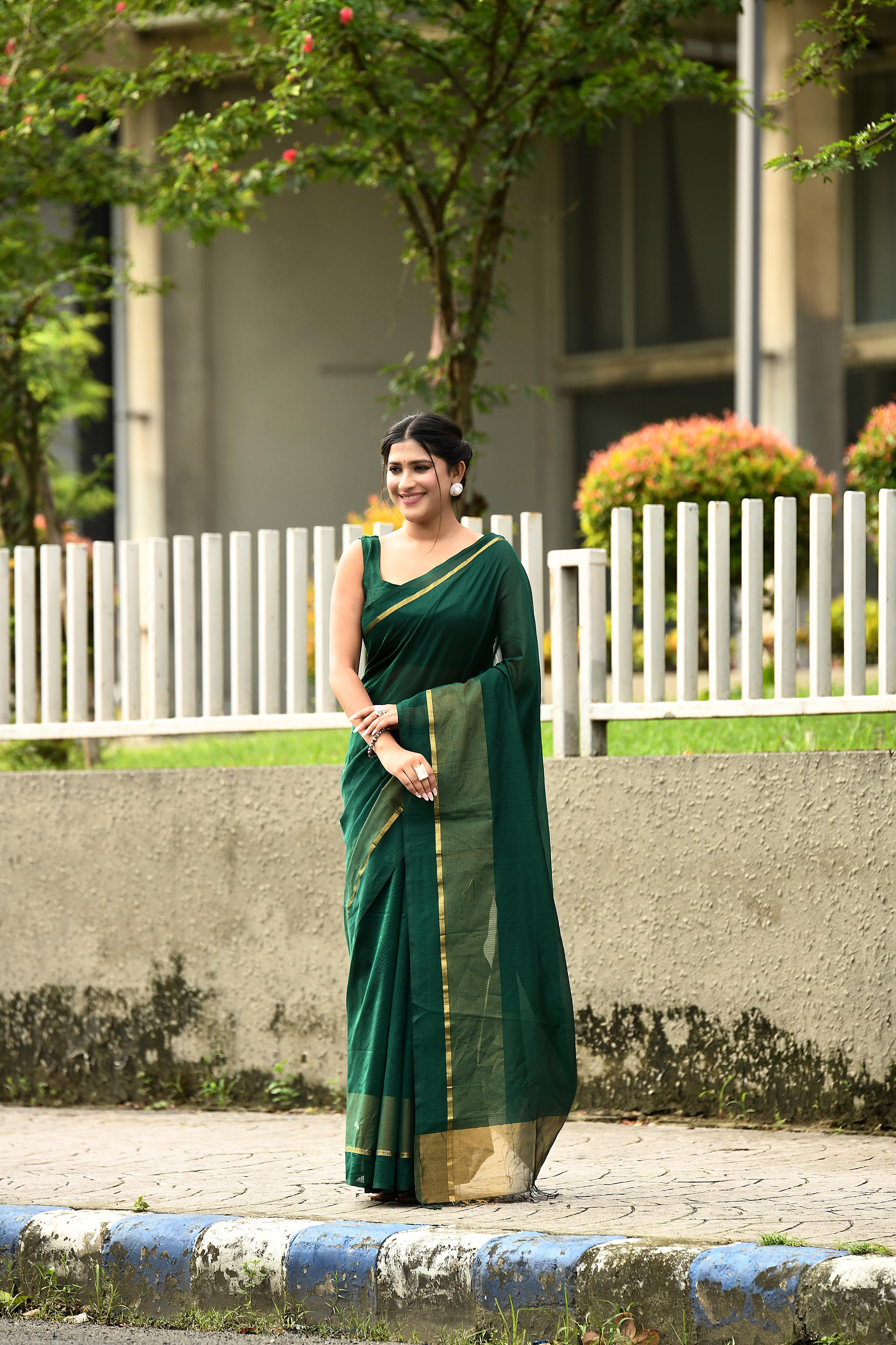 Bottle green cotton silk handwoven saree with self stripes and gold pallu