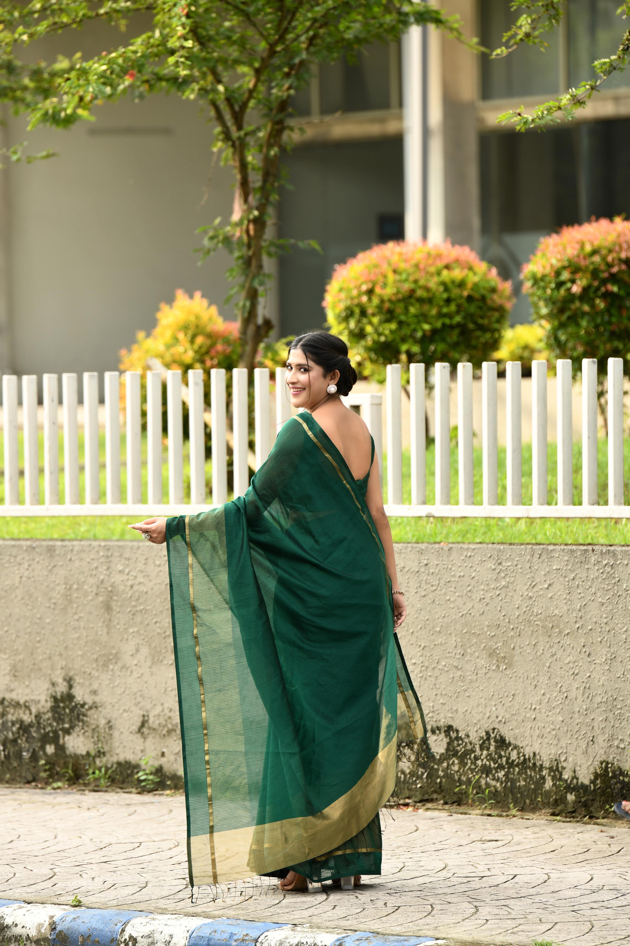 Bottle green cotton silk handwoven saree with self stripes and gold pallu