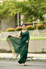 Bottle green cotton silk handwoven saree with self stripes and gold pallu