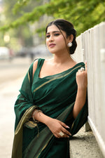 Bottle green cotton silk handwoven saree with self stripes and gold pallu