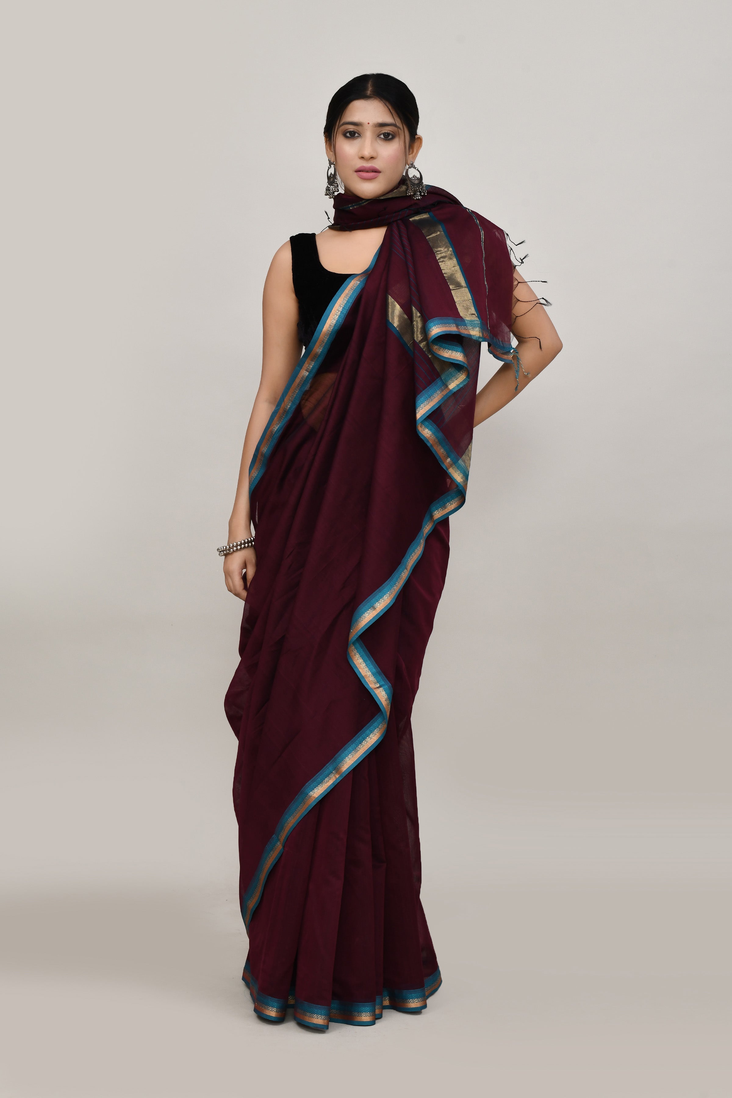 Coffee brown cotton silk hand woven saree with teal blue and golden border