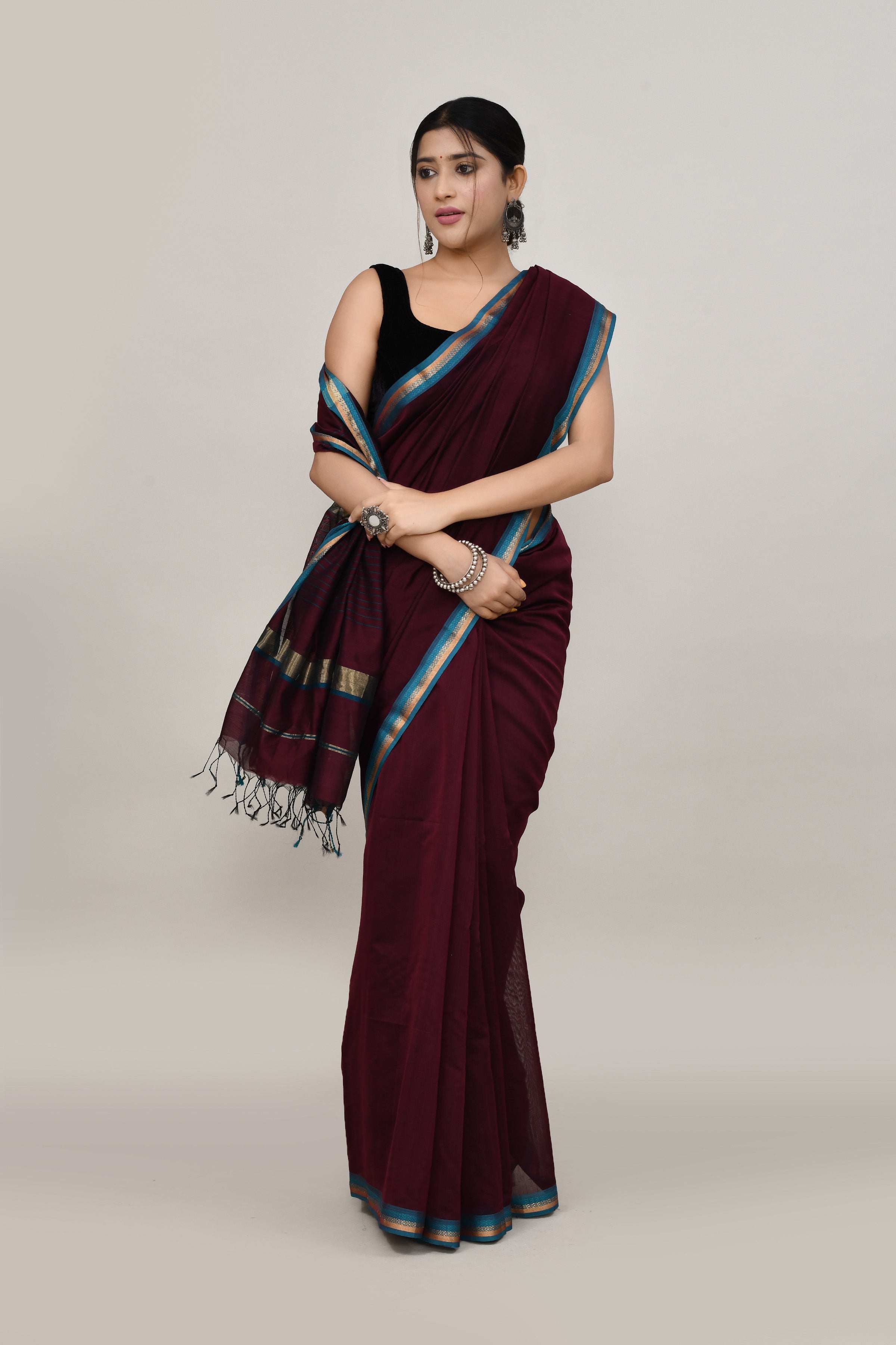 Coffee brown cotton silk hand woven saree with teal blue and golden border