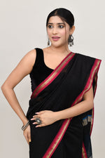 Black cotton silk hand woven saree with dark pink and golden border