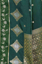 Banarasi soft silk saree with gold and silver zari weaving and cutdana embroidery in border- Dark Green