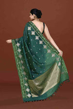 Banarasi soft silk saree with gold and silver zari weaving and cutdana embroidery in border- Dark Green