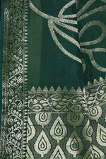 Banarasi woven soft silk saree with floral pattern motifs in gold zari - Bottle green