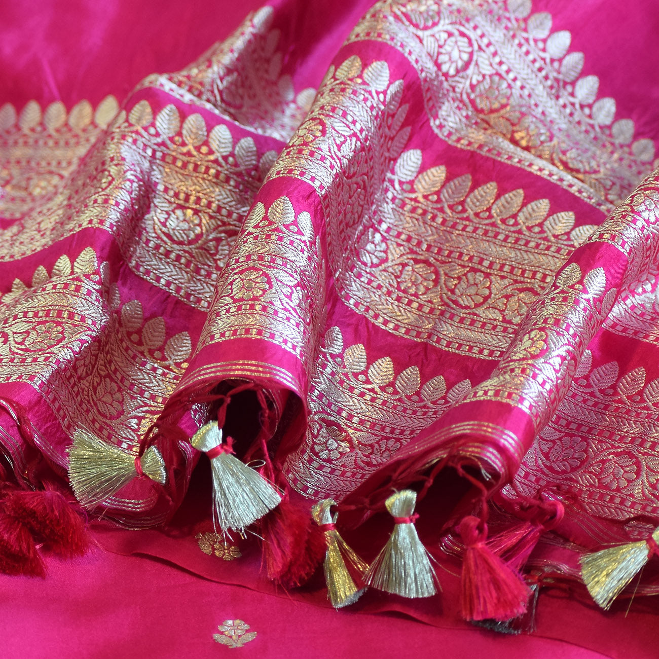 Rani Pink Handwoven Banarasi Munga Muslin Suit Set with Intricate Zari Borders & Playful Tassels