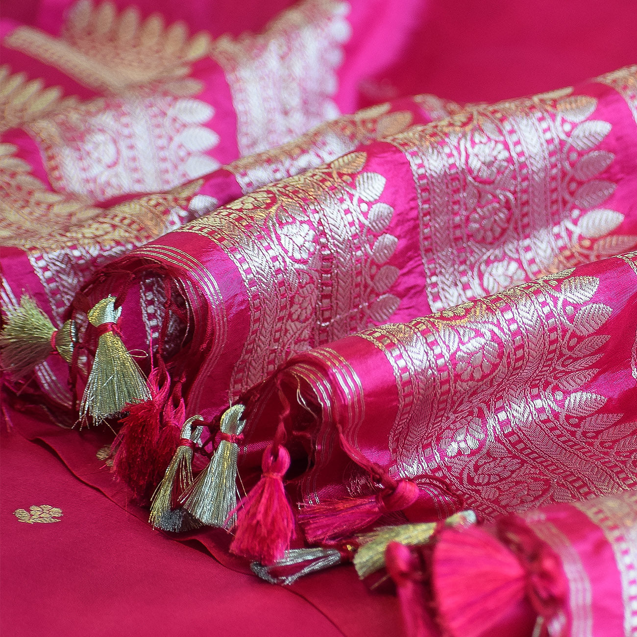 Rani Pink Handwoven Banarasi Munga Muslin Suit Set with Intricate Zari Borders & Playful Tassels