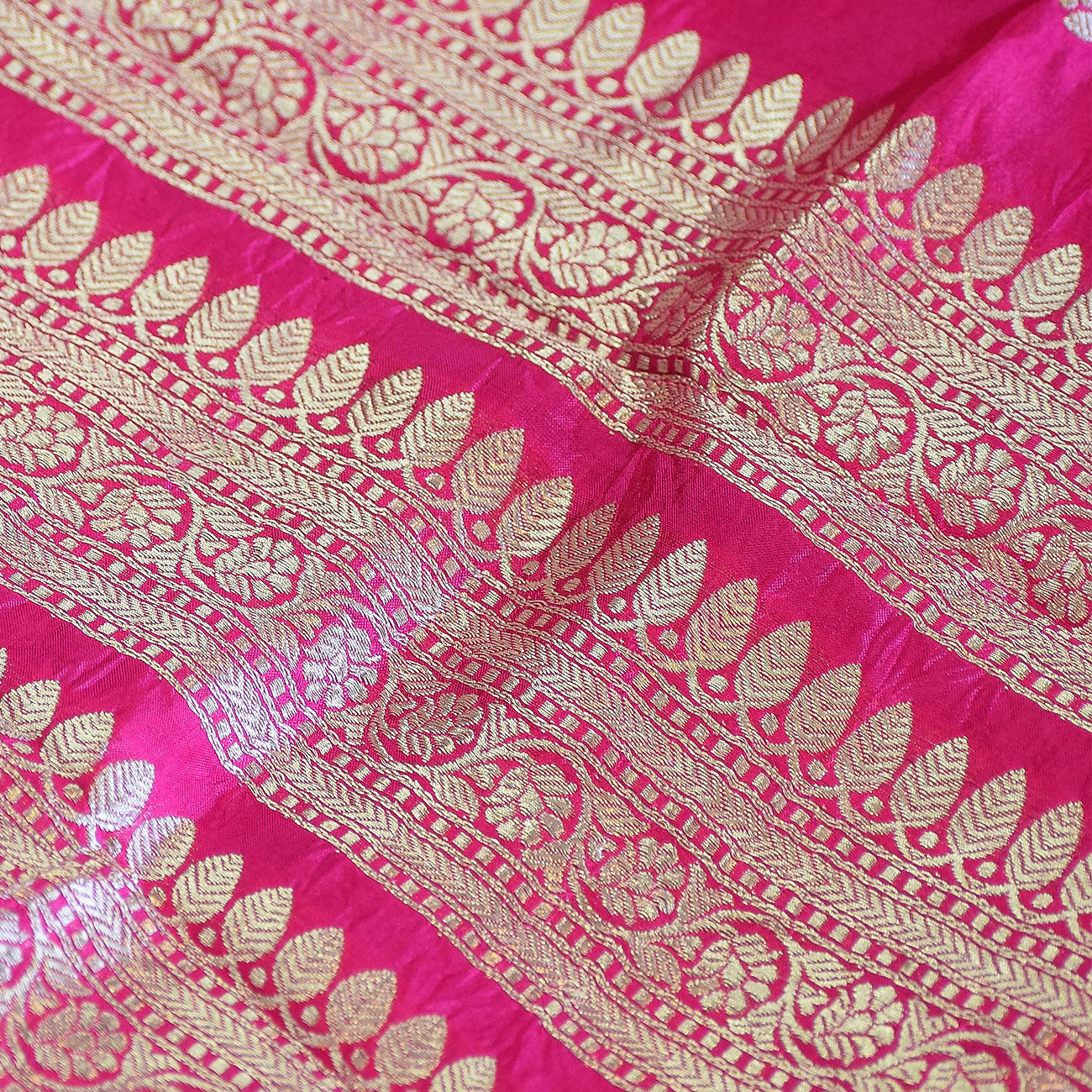 Rani Pink Handwoven Banarasi Munga Muslin Suit Set with Intricate Zari Borders & Playful Tassels